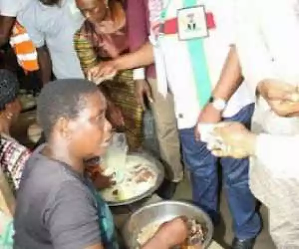 Governor Wike Pictured Buying Things At A Market In Rivers State